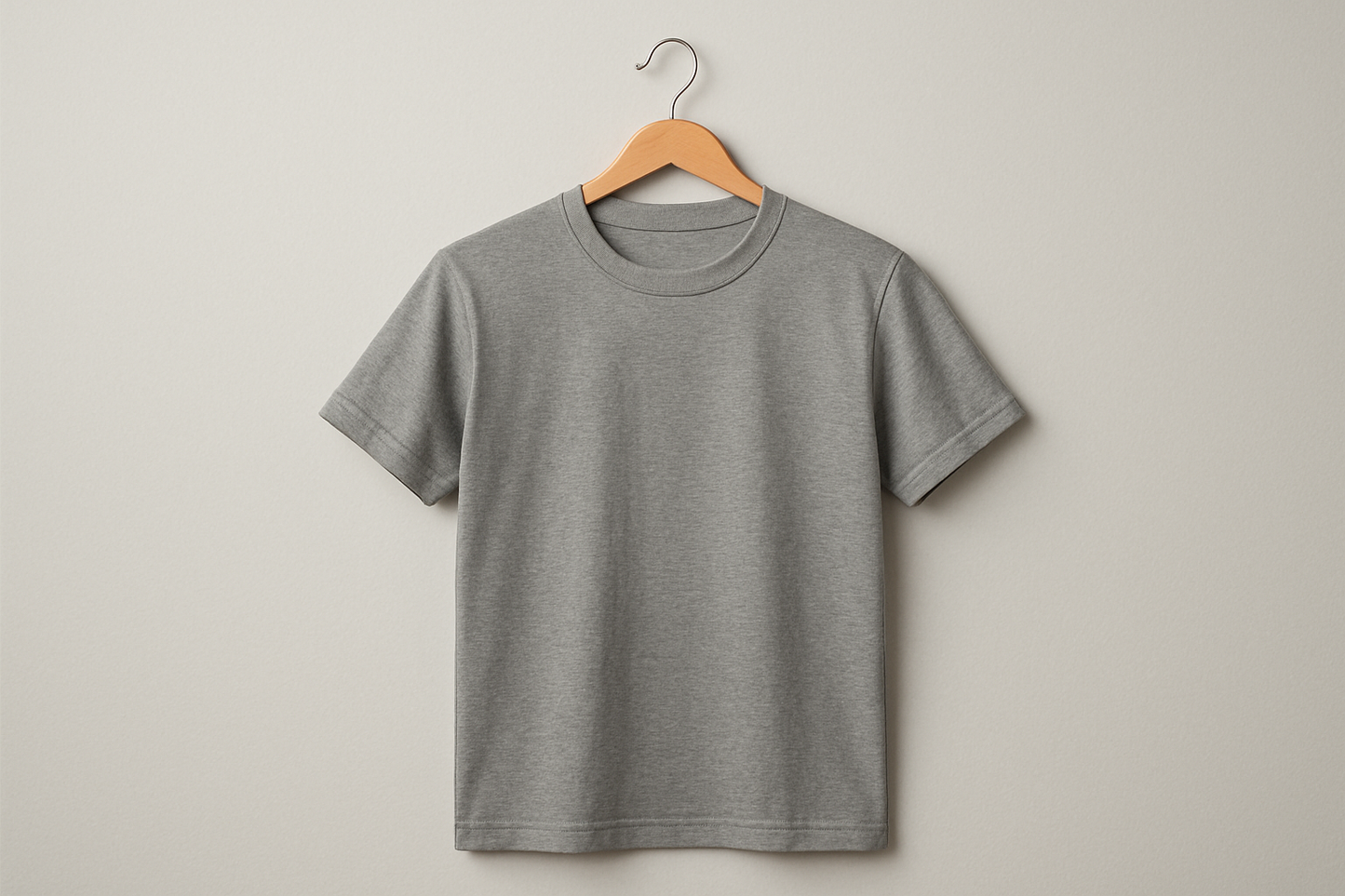 A grey T shirt on a hanger 