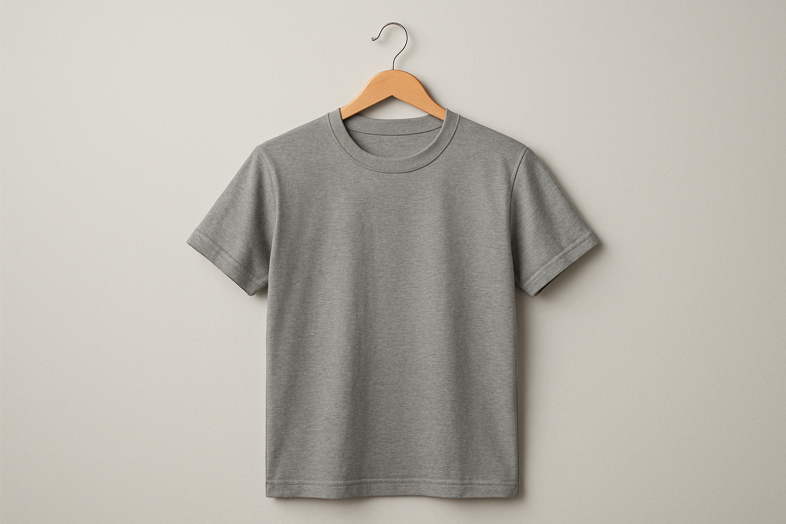 A grey T shirt on a hanger 