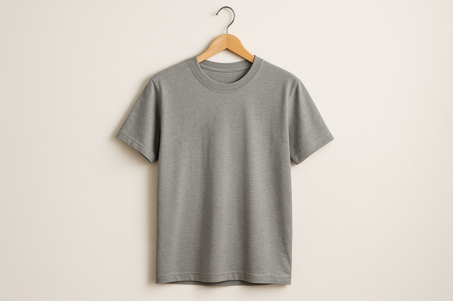 A grey T shirt on a hanger 